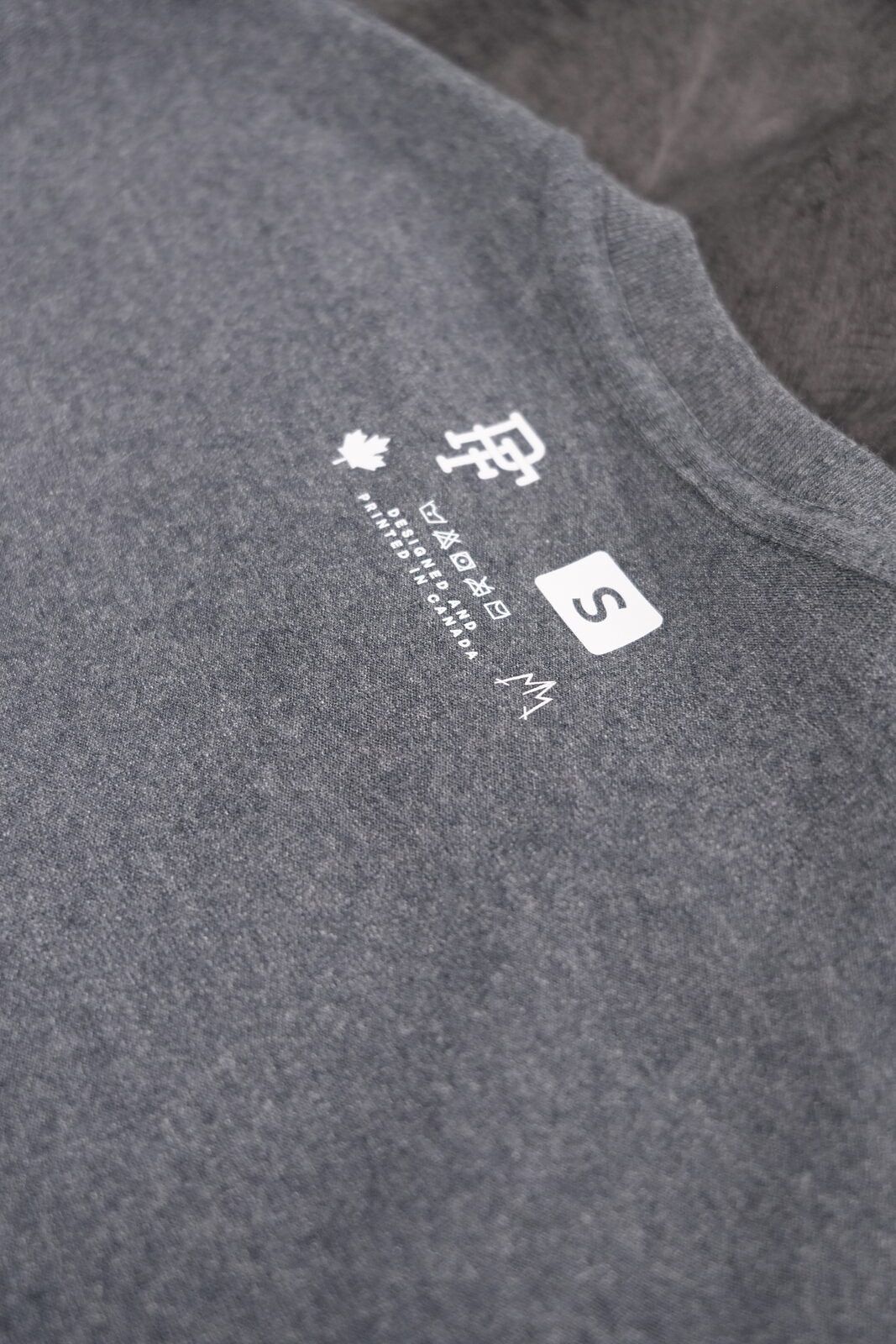 Minimalist branding — fine-detail DTF on heather grey