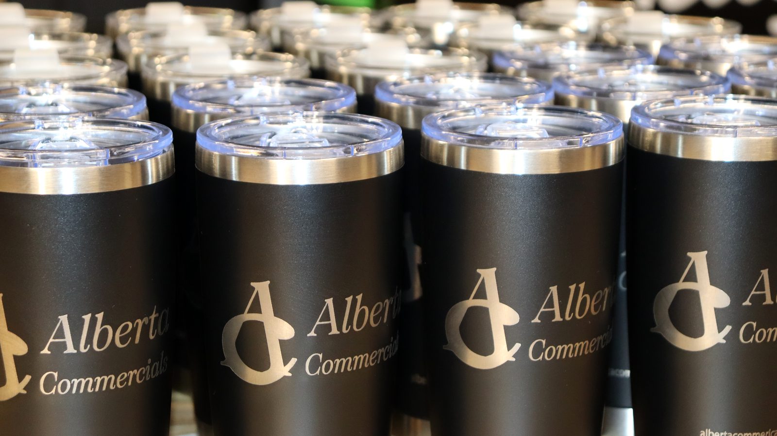 Laser-engraved Alberta tumblers — corporate gifting run