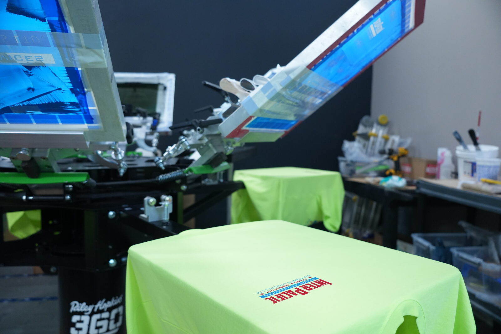 Production floor — running a Calgary team order on the carousel press