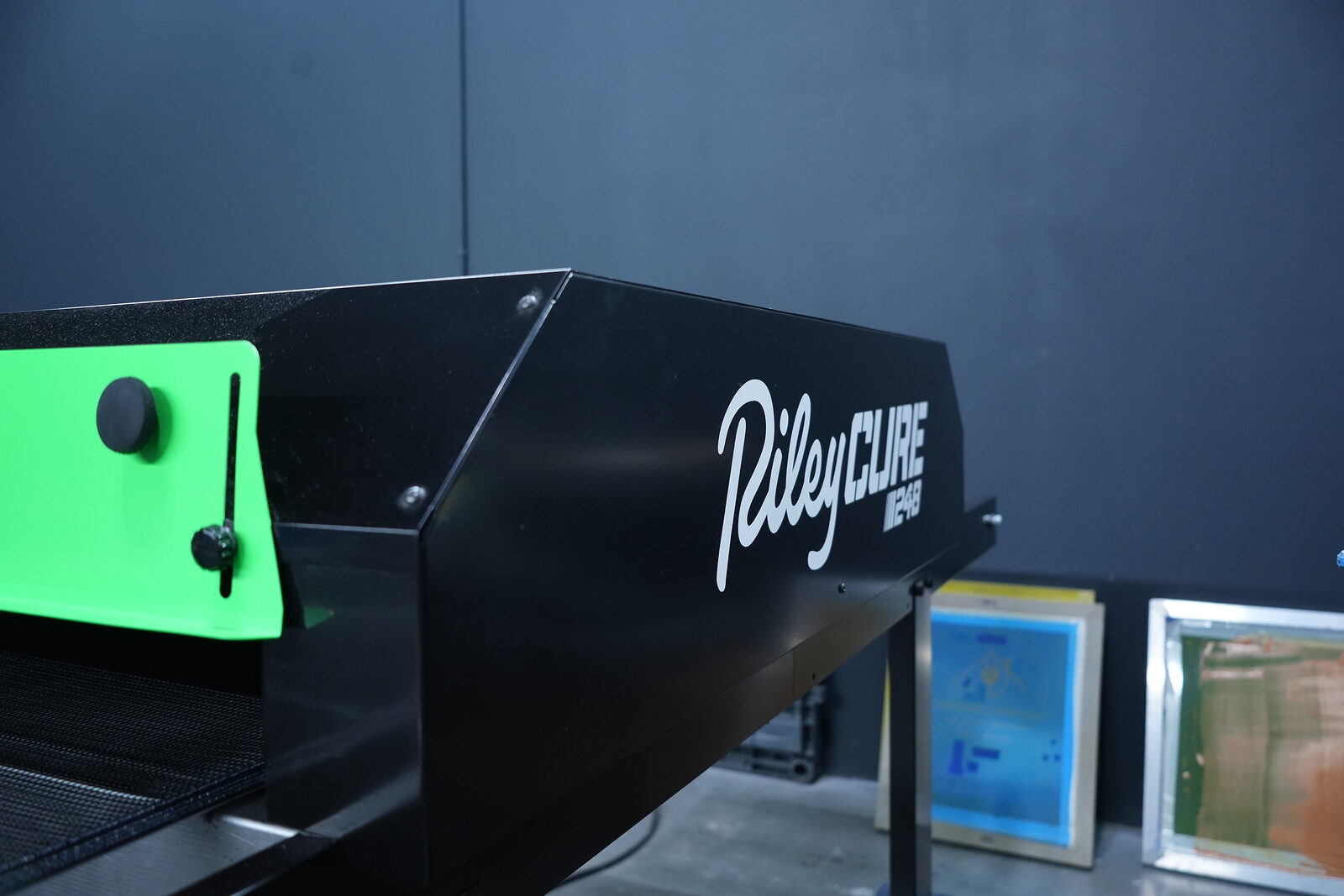 Riley Cure conveyor dryer — every print fully cured at 330°F