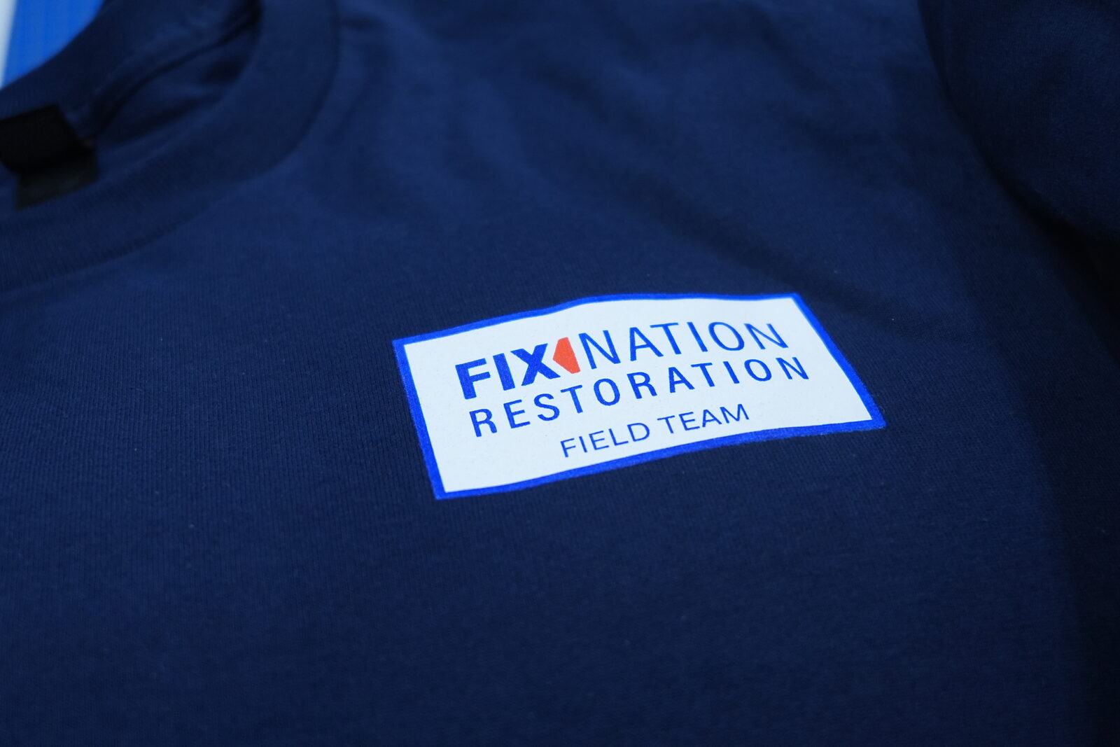 Fix Nation Restoration DTF patch on navy tee