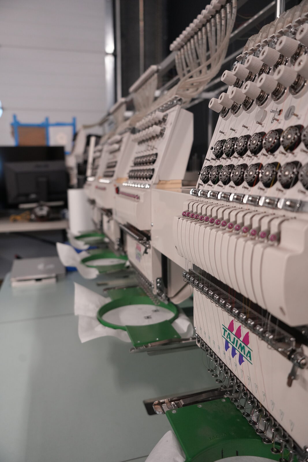 Tajima multi-head embroidery machines on the Singh Customs shop floor