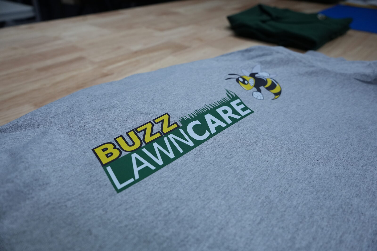 Buzz Lawncare full-colour print on grey tee